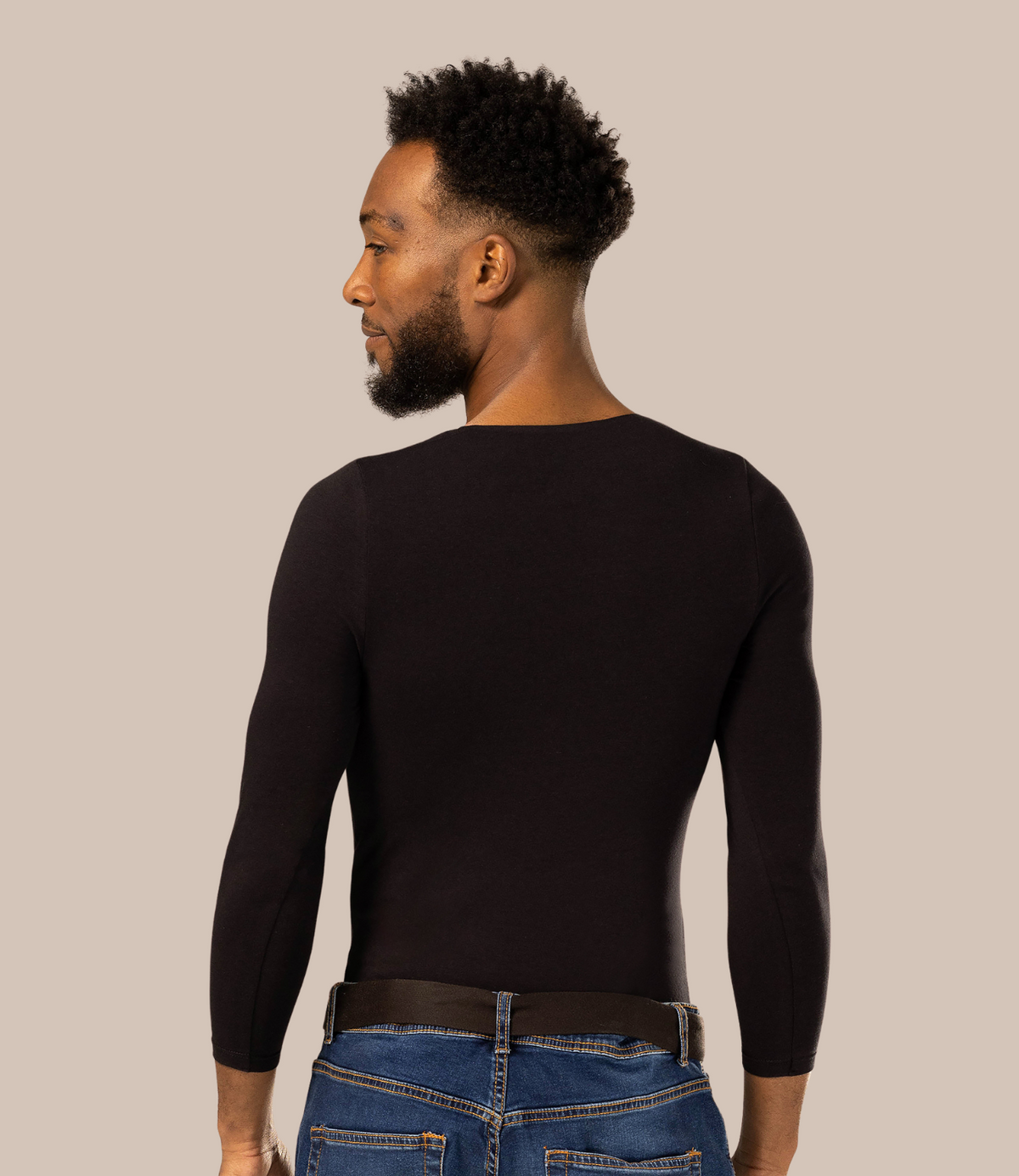 Man with dark skin tone wearing mens deep v neck undershirt