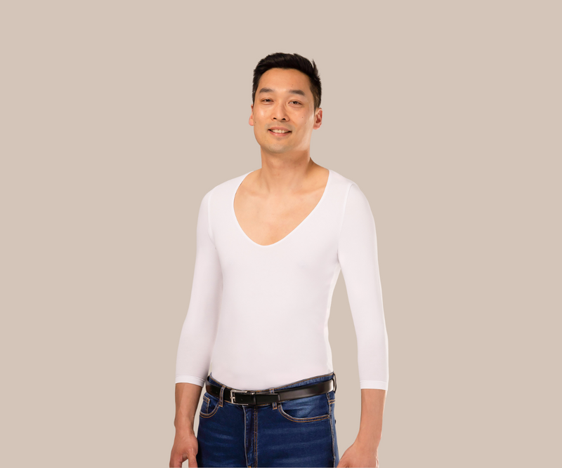 Smiling man wearing a deep v neck mens white undershirt