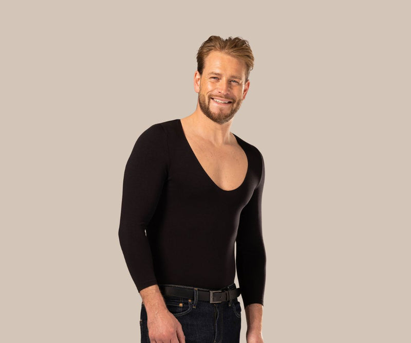 Smiling man wearing a deep v neck undershirt for men