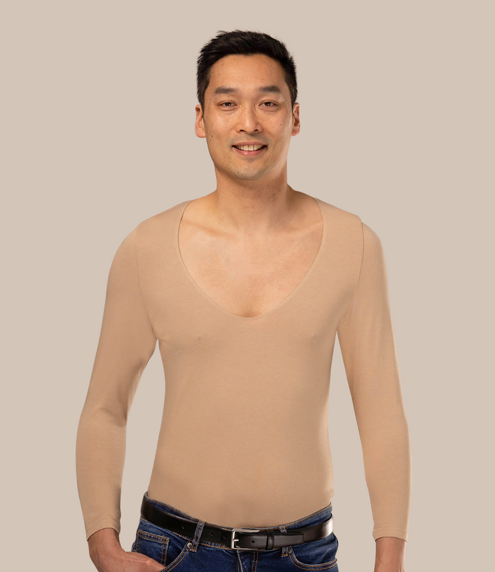 Man wearing long sleeve men's beige undershirt with v-neck