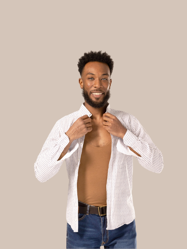 Smiling man adjusting collar getting changed with shirt unbuttoned and undershirt for men showing