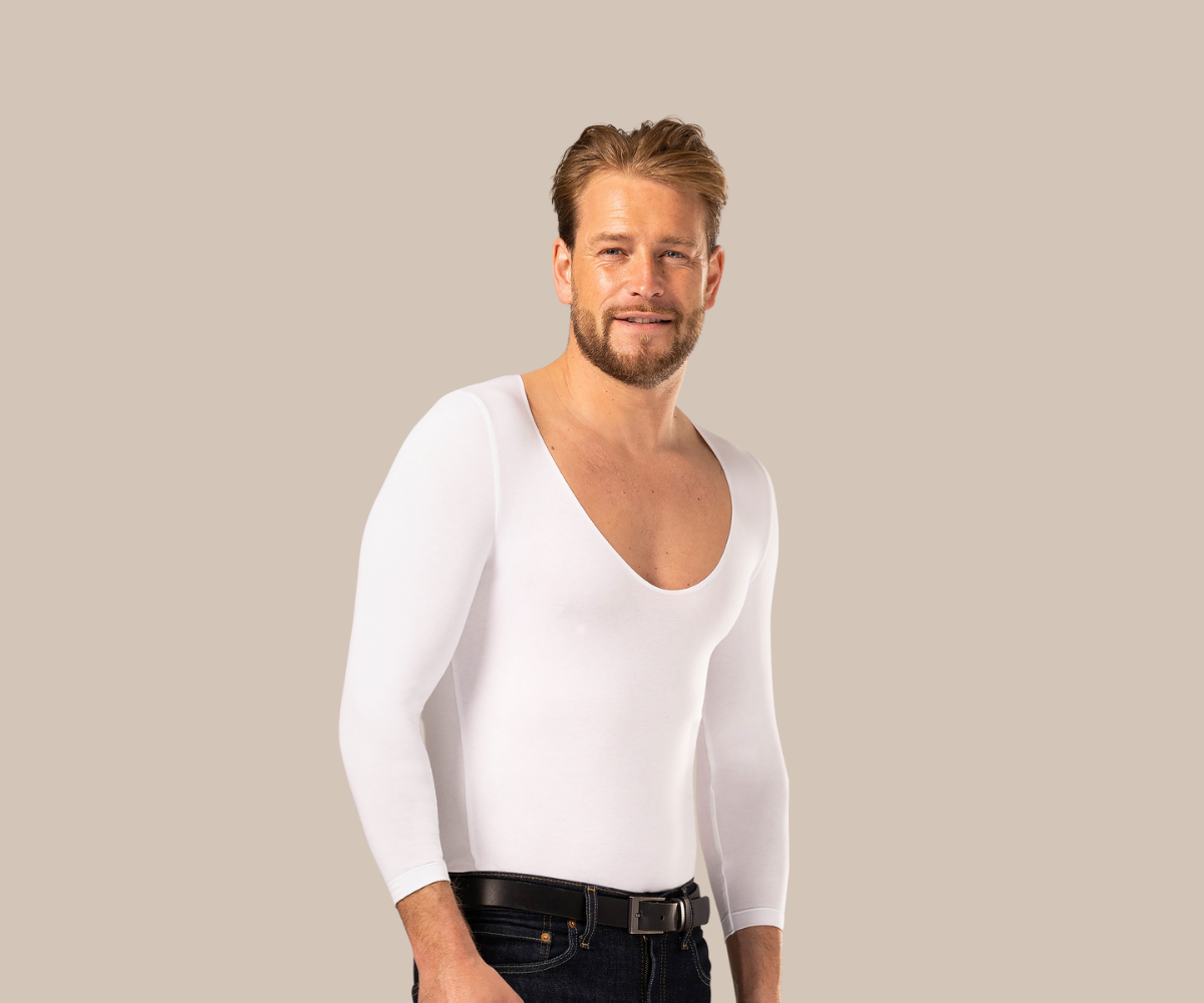 Smiling man wearing skinda white men's undershirt