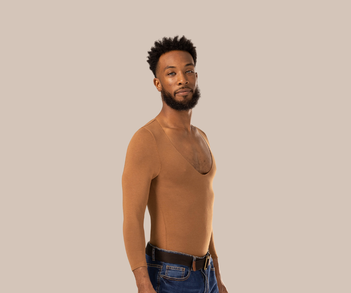 Man standing side on wearing brown men's undershirt